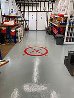 a photo of the newly painted boat house floor with compas points