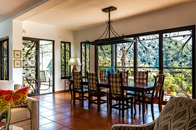 Rectangulat Eight-Piece Dining Table Placed Near Wide Window
