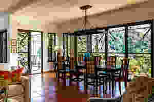 Rectangulat Eight-Piece Dining Table Placed Near Wide Window