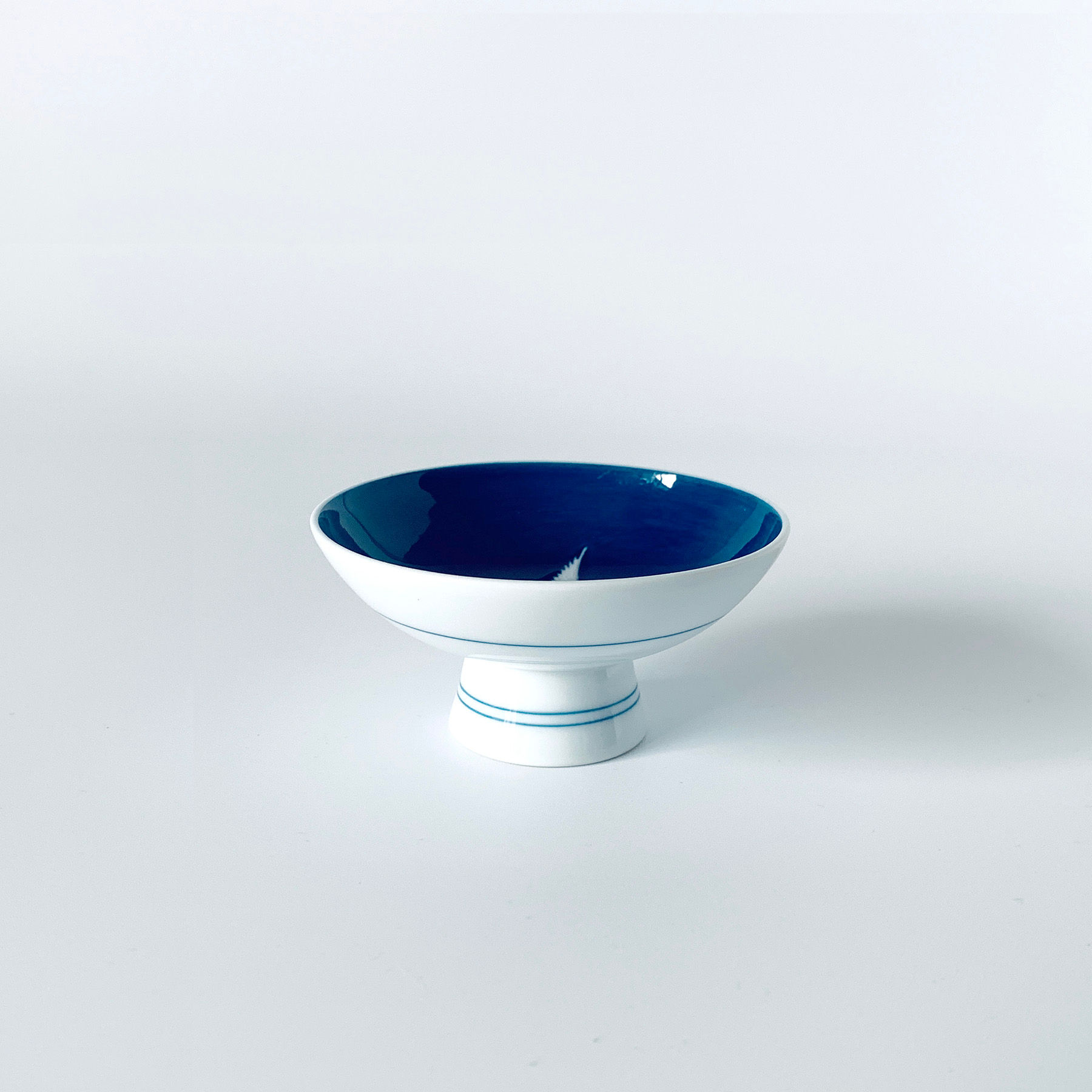 Japanese Crane Porcelain sake cup: "Okiage" slip-painting on porcela