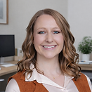 Smiling woman in office setting.