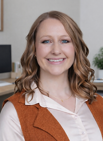 Smiling woman in office setting.