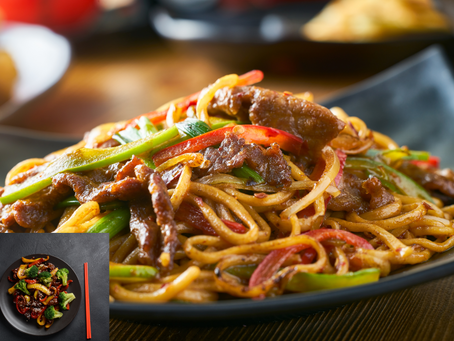 Close-up view of a vibrant stir fry with mixed vegetables and protein