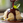 Close-up view of a rich, glossy chocolate sauce drizzling over a vanilla ice cream scoop