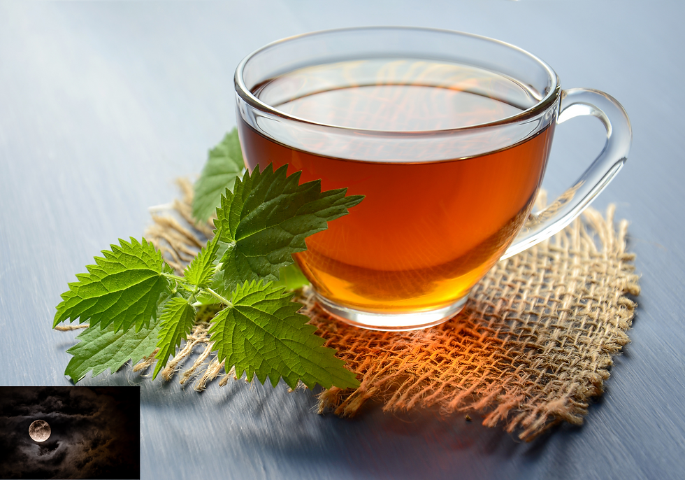 A clear cup of moon tea on a burlap mat with green leaves beside it. A small inset shows a cloudy night sky with a full moon.