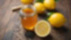 Close-up view of a jar filled with lemon and black seed honey
