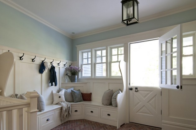 A mud room featuring a wooden bench and a coat rack-built in durham