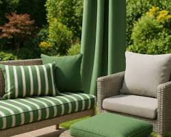Reupholstered outdoor wicker patio furniture set with UV-resistant green and beige cushions in a sunny backyard setting by Dallas Home Fabric Center