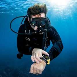 Oceanic+ app on Apple Watch Ultra displaying real-time dive data underwater