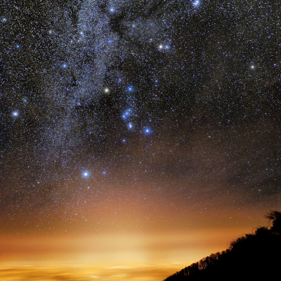 The three stars of Orion's belt (middle) pointing downward toward Sirius on the bottom left.