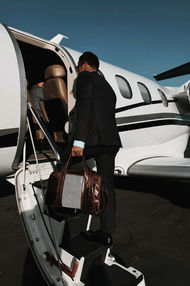 A Carrera classic leather bag on a private jet