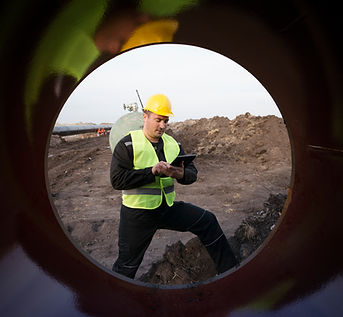 shot-oilfield-worker-checking-quality-gas-pipes-construction-site.jpg