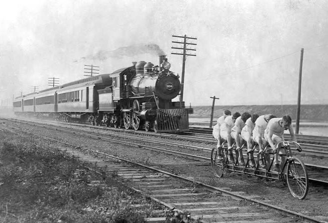 In July 25, 1896, the E. C. Stearns held a spectacular marketing event – a race between its popular sextuplet and a locomotive on a straightaway section of track outside Buffalo, New York. But not just any locomotive, The Empire State Express of the New York Central and Hudson River Railroad line, with Engine 999 in front. They selected six of the best of the Stearns team, including Oscar Hedstrom and Charles Henshaw with William Bex nominated for the difficult and dangerous job of steersman. 