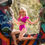 Thumbnail: Girl in fuchsia dance costume poses outdoors