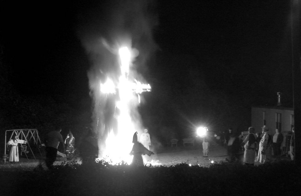 Ku Klux Klansmen and women at a cross lighting in on November 12th, 2005, CC BY-SA 3.0