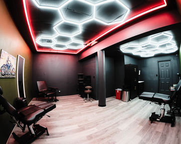Private tattoo room with neon lighting at Cherno Ink Tattoo Studio