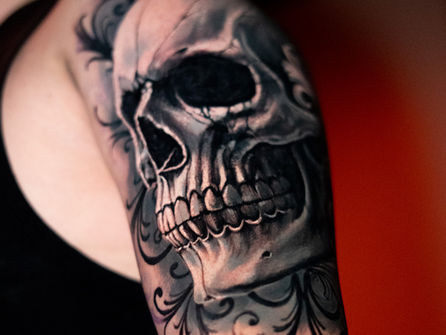 Black and grey realism skull tattoo by Ivo Angelov, Huntsville AL