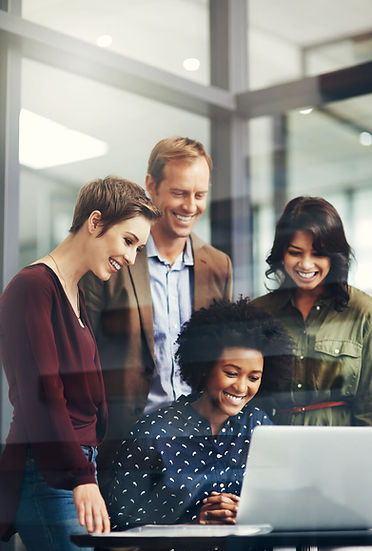 A group of business people working around a computer
