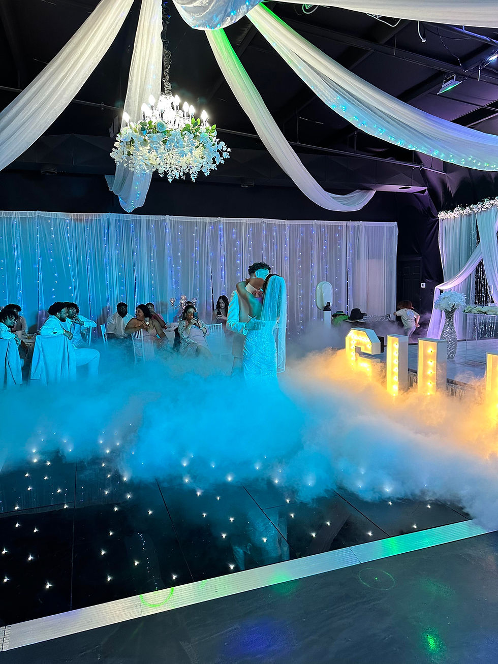 Couple dancing with one of our popular rental dry ice fog on the dance floor for 1st dance!