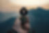 Hand holding a compass to navigate mountain terrain, symbolizing cybersecurity strategy, process, and guided execution.