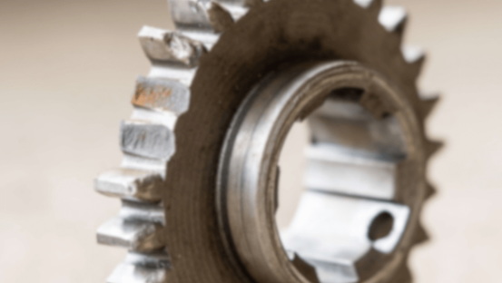 Gear with missing teeth — symbolizing broken cybersecurity governance and leadership accountability gaps.