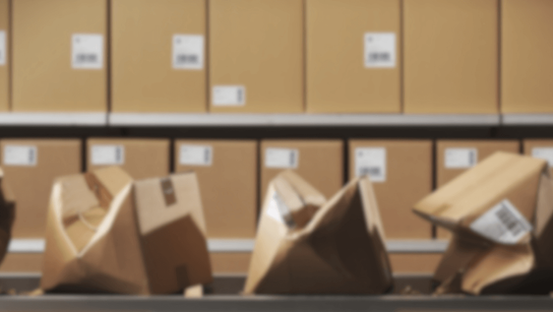 Crushed boxes on an assembly line — symbolizing failed execution without cybersecurity process discipline.