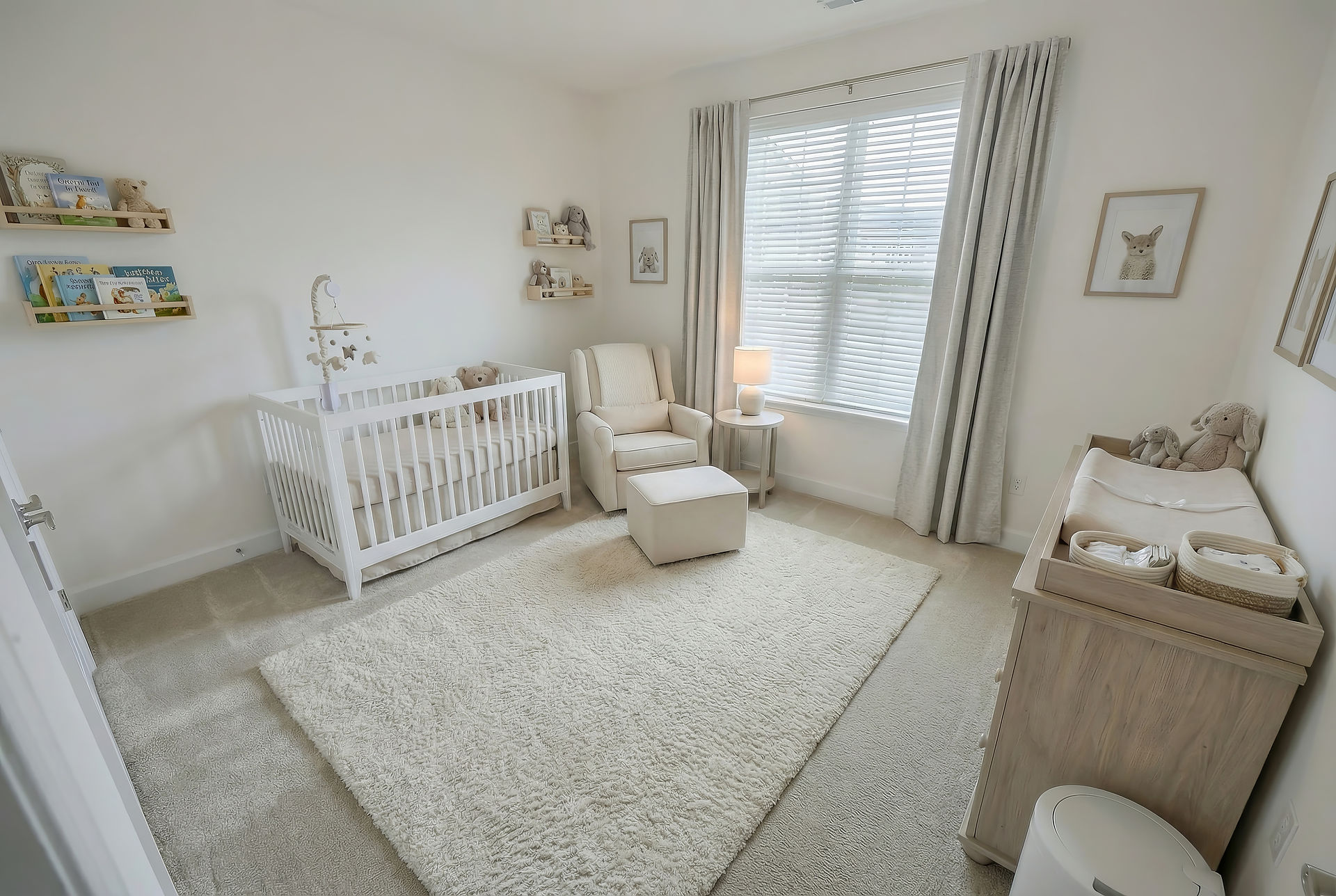 Virtual staging of a soft neutral nursery featuring a white crib, cozy armchair with ottoman, natural wood changing table, and warm layered textiles in a Soft Contemporary and Cozy Transitional style.