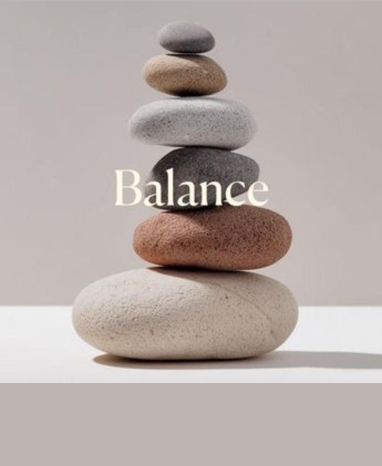 Balanced stack of stones with 'Balance' text