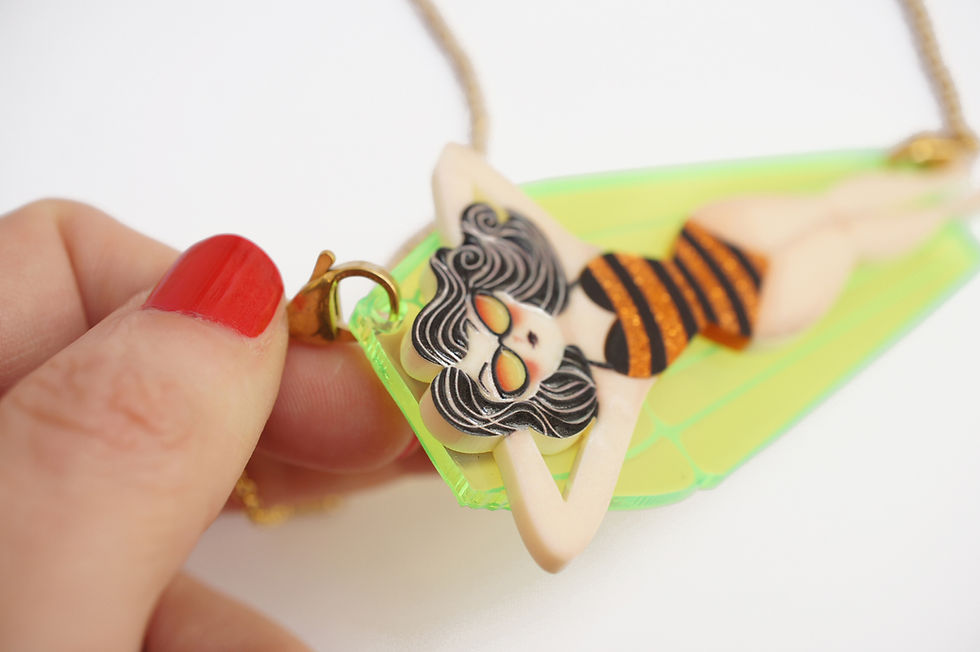 Thumbnail: Necklace/Brooch Girl on inflatable mat