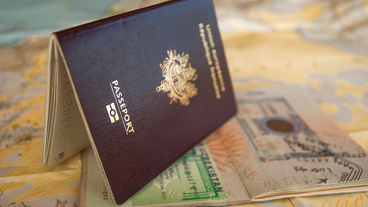 Passport on a map, indicating super visa is for parents of Canadian citizens