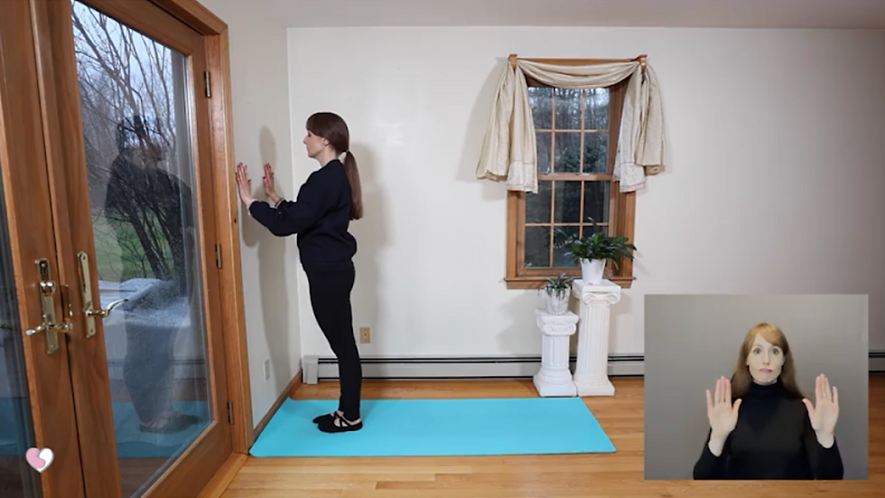 The Healthy Yogini does a yoga position using a door for support