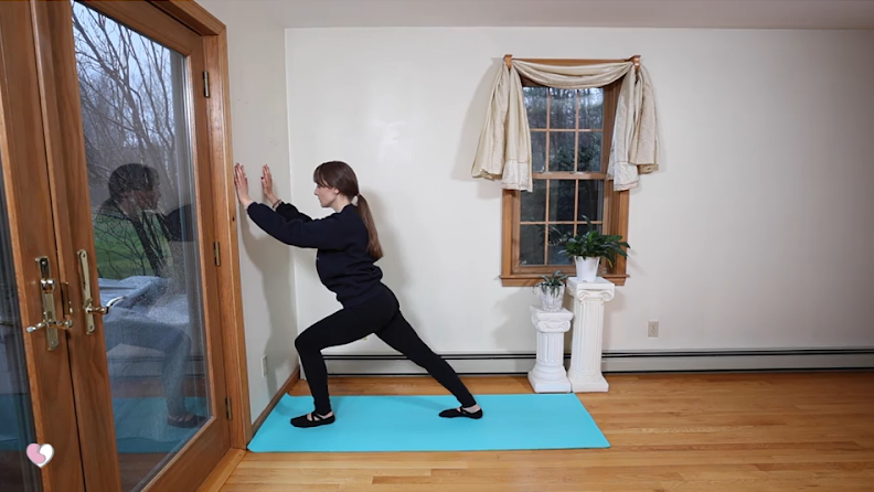 Thumbnail: The Healthy Yogini does a yoga lunge with a door for support