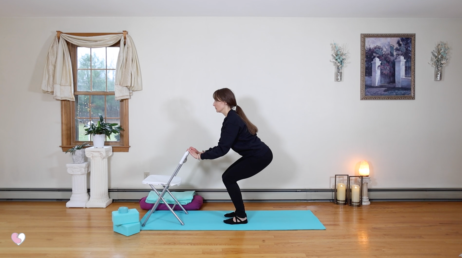 The Healthy Yogini in chair pose on a yoga mat