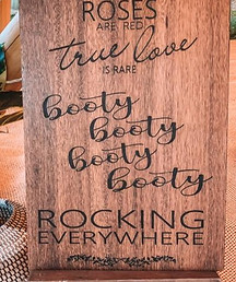 booty rocking sign