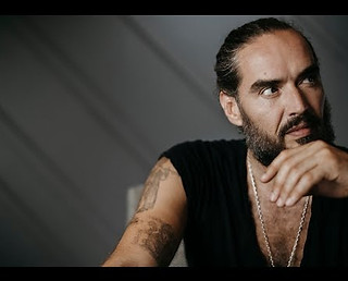 Russell, Brandin black singlet looks out of shot