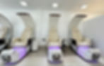 Modern luxury pedicure bar featuring plush chairs and elegant spa design in Grand Cayman