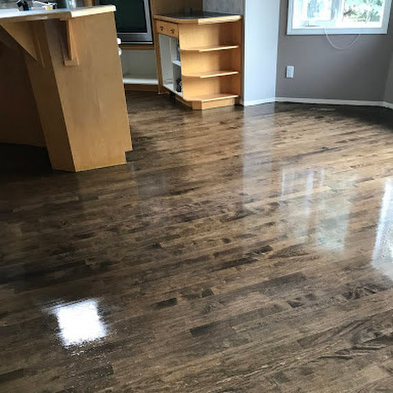 Stained Hardwood Floor in a kitchen and dining room