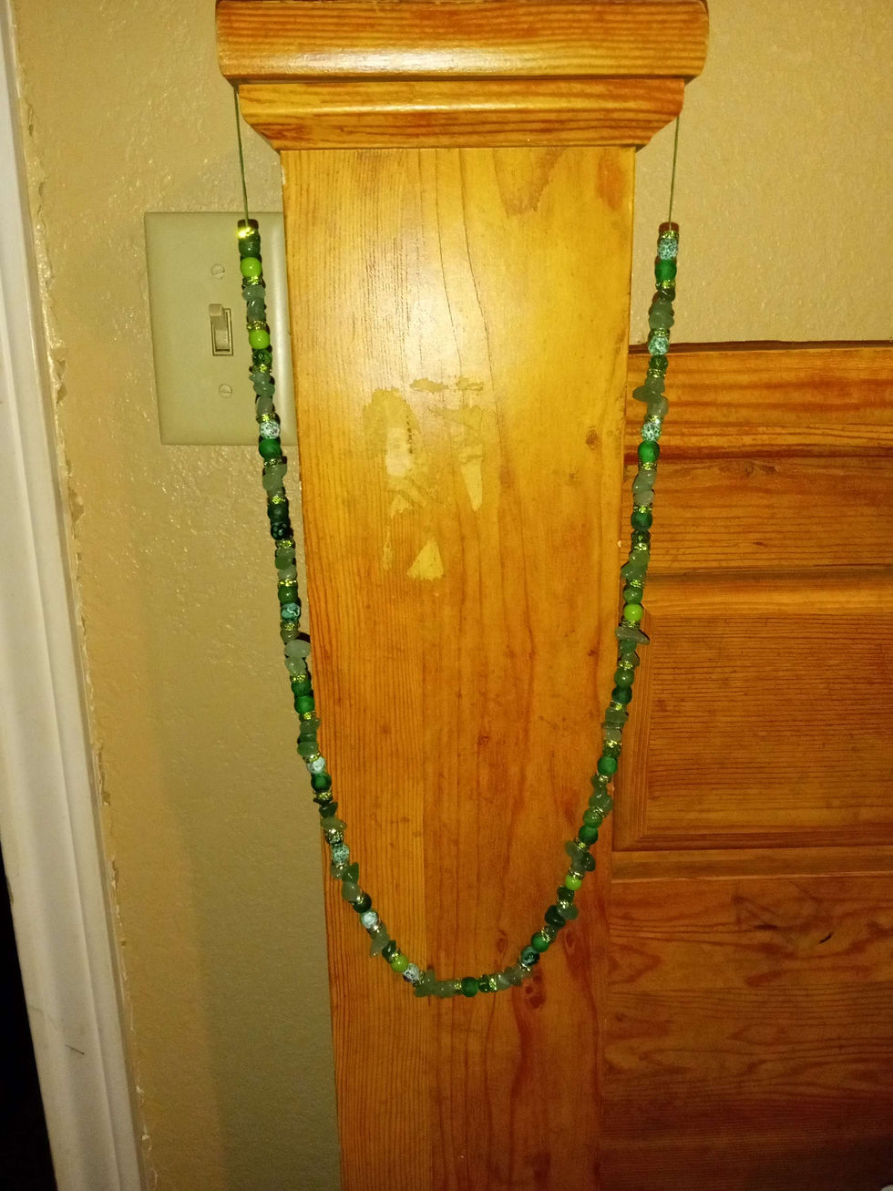 Thumbnail: Long necklace made with green healing crystals and beads 