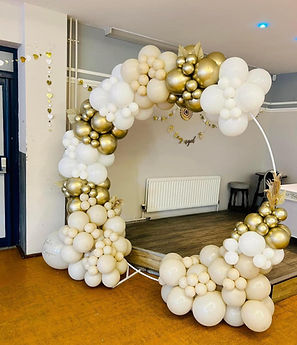 Balloon display on metal round frame. Silver, white and cream colours.