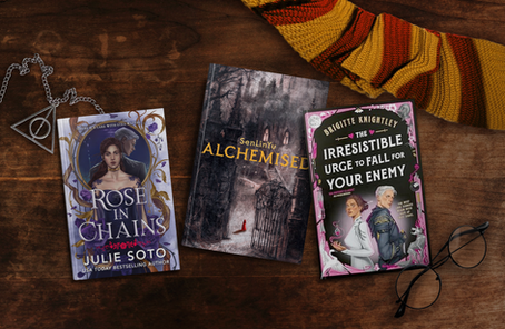 Three books surrounded by Harry Potter ephemera. Books are: Rose in Chains by Julie Soto, Alchemised by SenLinYu, and The Irresistible Urge to Fall for Your Enemy by Brigitte Knightley.