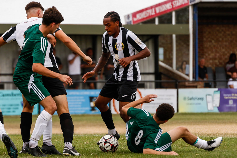 Woodbridge Town's Kie Dyer battling with Isaac Lewis (Photo: Max Woodward)