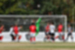 Toby Hurst punching the ball away from a corner (Photo: Max Woodward)