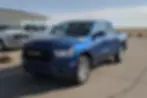 a clean reliable pickup parked on a dealership lot under a bright sky