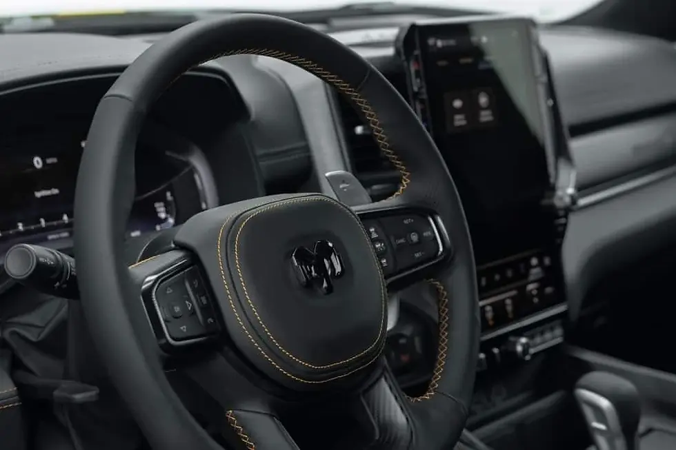 Inside the Ram 1500 Rumble Bee, the performance cockpit with a flat bottom steering wheel