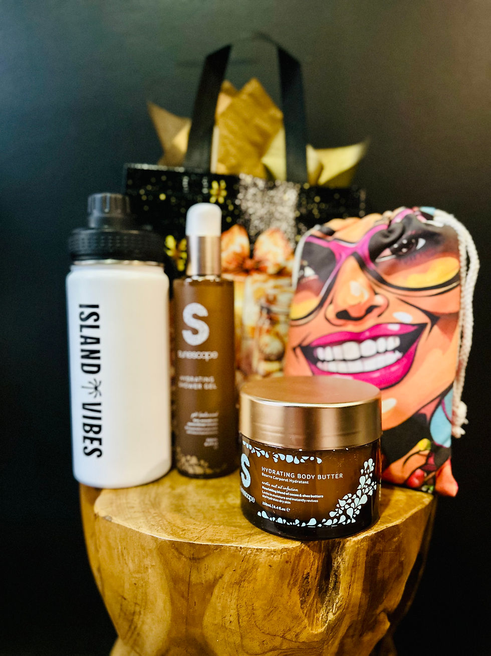 Eye-level view of sunscreen and tanning products on a sandy beach background