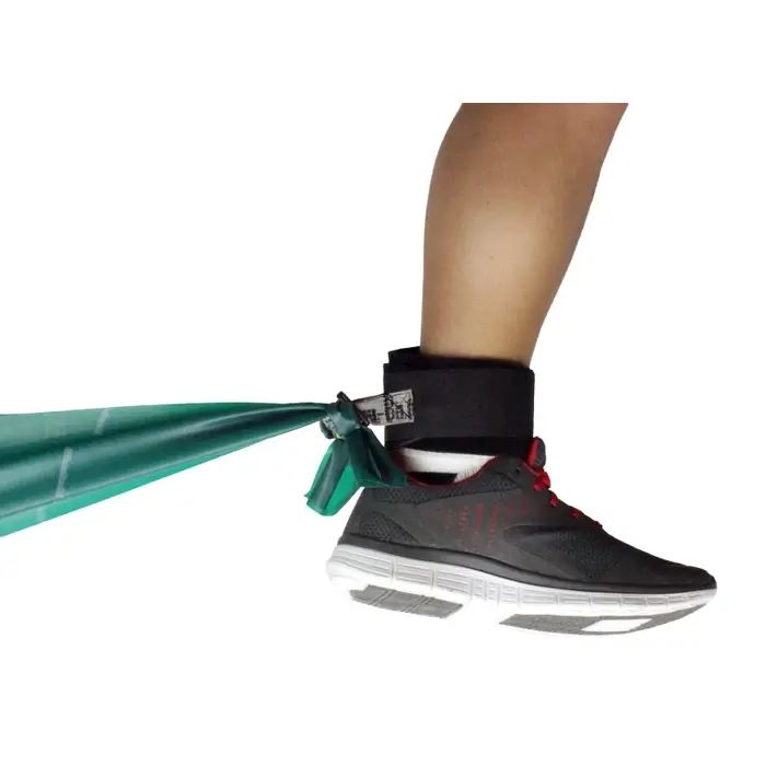 Person using TheraBand Extremity Strap on ankle for physical therapy resistance training