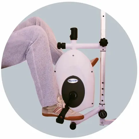 Patient using CURAMOTION EXER II for upper and lower body stroke rehabilitation