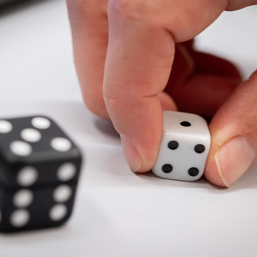 BoBo Dice in-hand manipulation exercise — patient rotating smart dice in palm for fine motor training