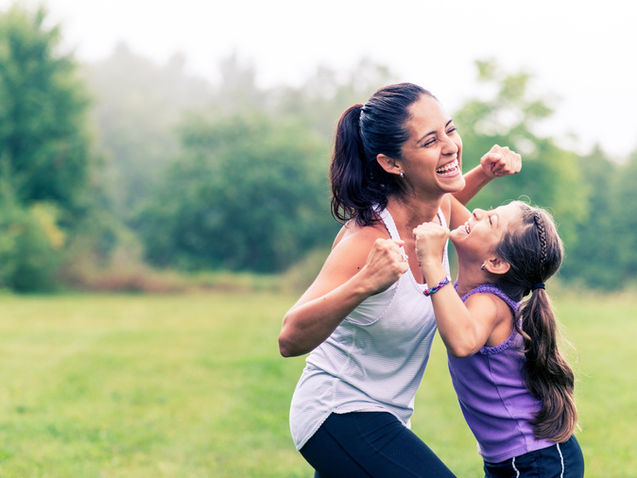 Mom and daughter playing outside together and having fun | Parenting by Design