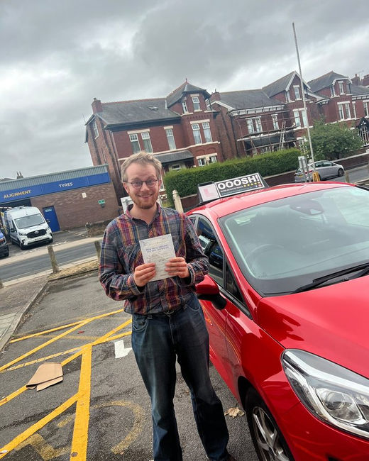 OOOSH! pupil with their pass certificate